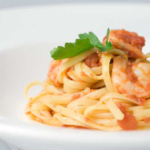 Plate of spicy prawn and tomato pasta