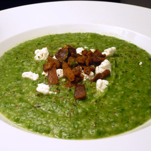 Spinach and potato puree in white bowl.