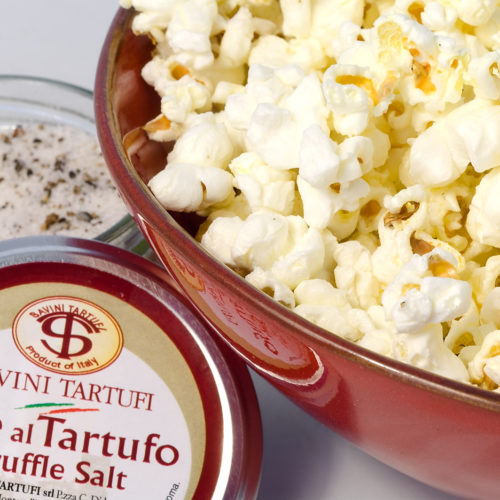 close up of truffle popcorn in red bowl.
