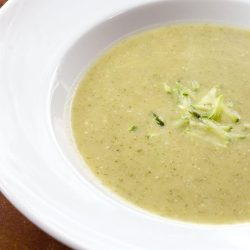 Zucchini soup in white bowl.