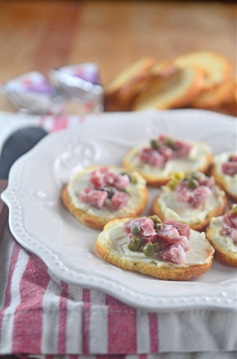 This 5 minute salami caper crostini comes together in a flash and is perfect for last minute holiday parties. 