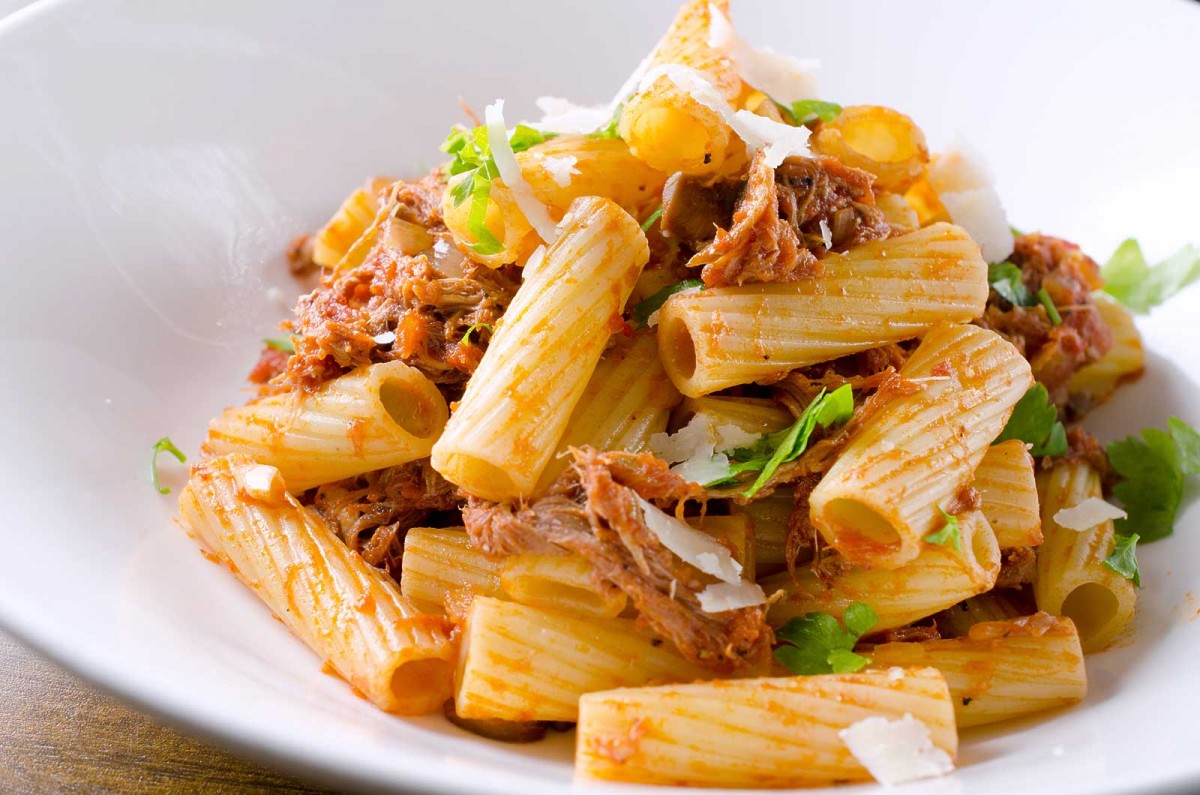 Pulled Pork Rigatoni is the best way to use leftover pulled pork. Pasta tossed with crushed tomatoes, pulled pork, onions, mushrooms and garlic.