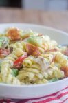 Make all the friends this summer with this Bacon Tomato Avocado Pasta Salad. It's a family favorite with crispy bacon, creamy avocado and sweet summer tomatoes.