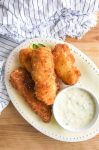 Fried Cod is our favorite fried fish. It's crispy on the outside and flaky on the inside. And it is perfect for dunking in homemade tartar sauce. 