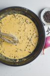 Overhead photo of peppercorn cream sauce in a skillet.