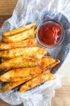 Potato wedges, or Jo Jo Potatoes as I like to call them, are perfectly seasoned and baked until golden.  Crispy on the outside and fluffy on the inside. They will be a hit with your whole family. 