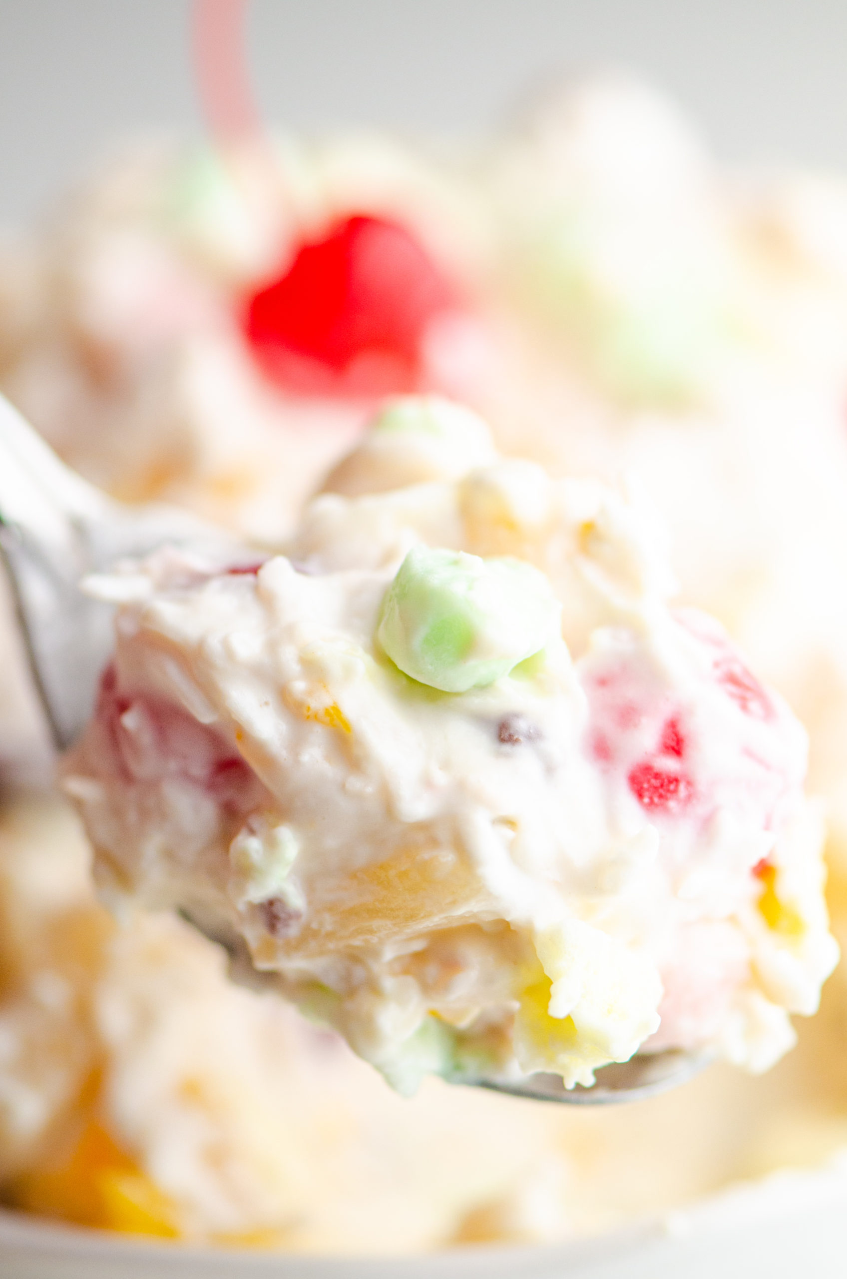 Spoonful of ambrosia salad. 