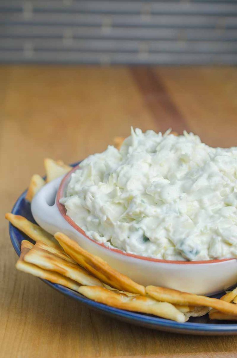 Creamy Artichoke Jalapeño Dip is a summer potluck must! Loaded with two cheeses, artichokes and jalapeños, it's impossible to resist. 