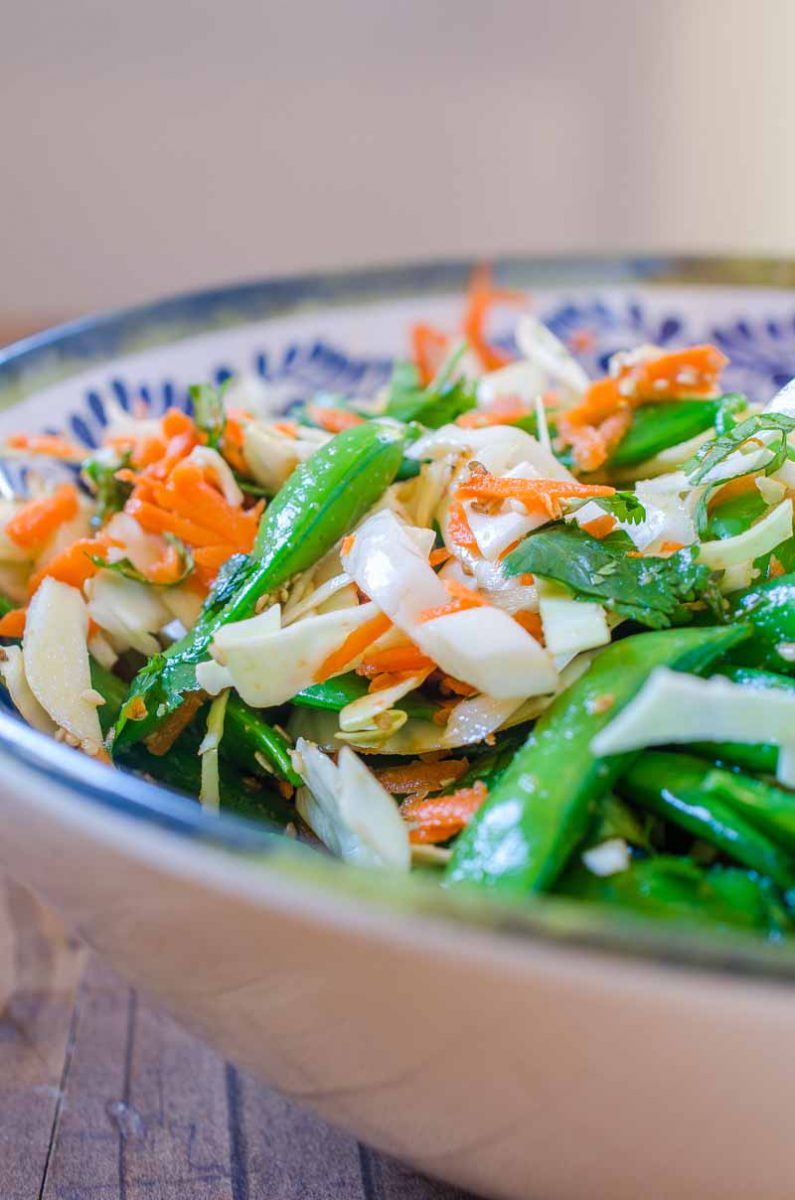 This Asian Cabbage Salad is a quick, easy and refreshing salad with cabbage, snap peas and carrots in a savory ponzu dressing.