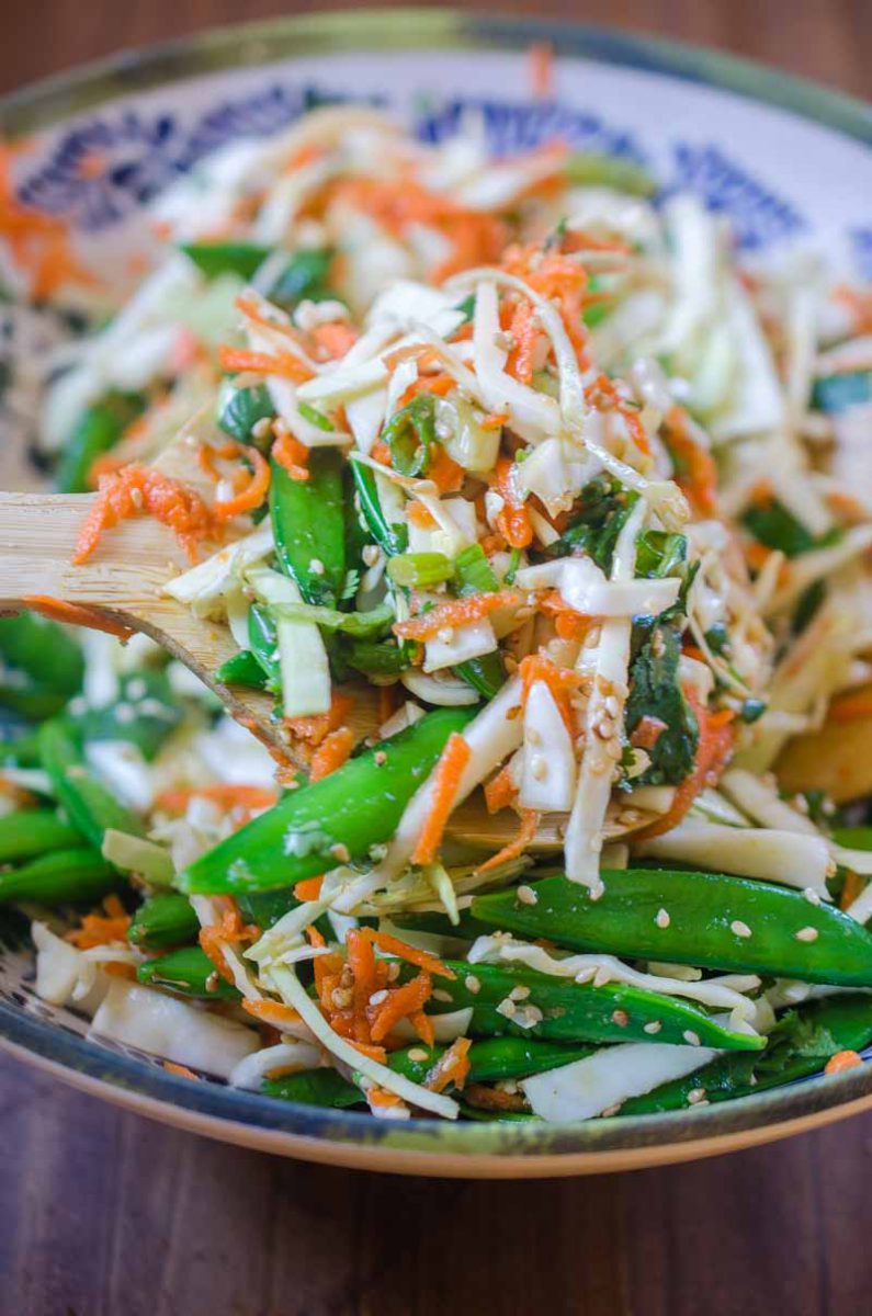 This Asian Cabbage Salad is a quick, easy and refreshing salad with cabbage, snap peas and carrots in a savory ponzu dressing.