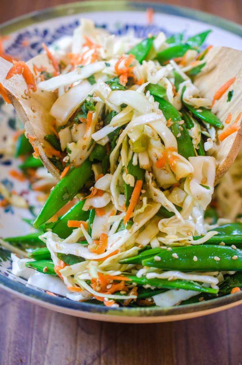 This Asian Cabbage Salad is a quick, easy and refreshing salad with cabbage, snap peas and carrots in a savory ponzu dressing.