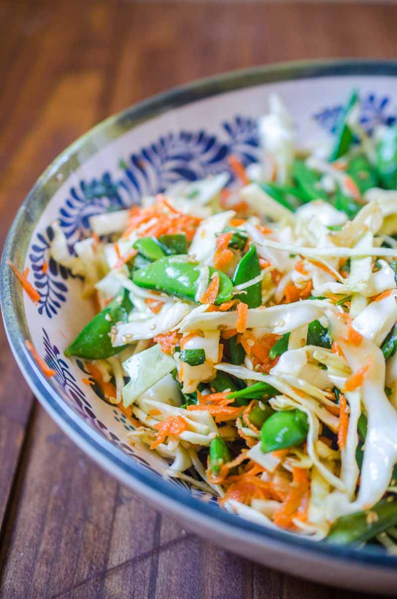 This Asian Cabbage Salad is a quick, easy and refreshing salad with cabbage, snap peas and carrots in a savory ponzu dressing.