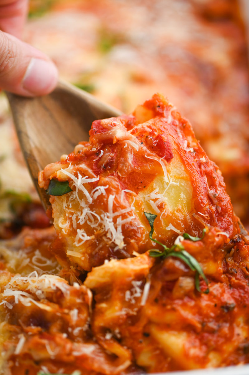 Spoonful of baked ravioli.