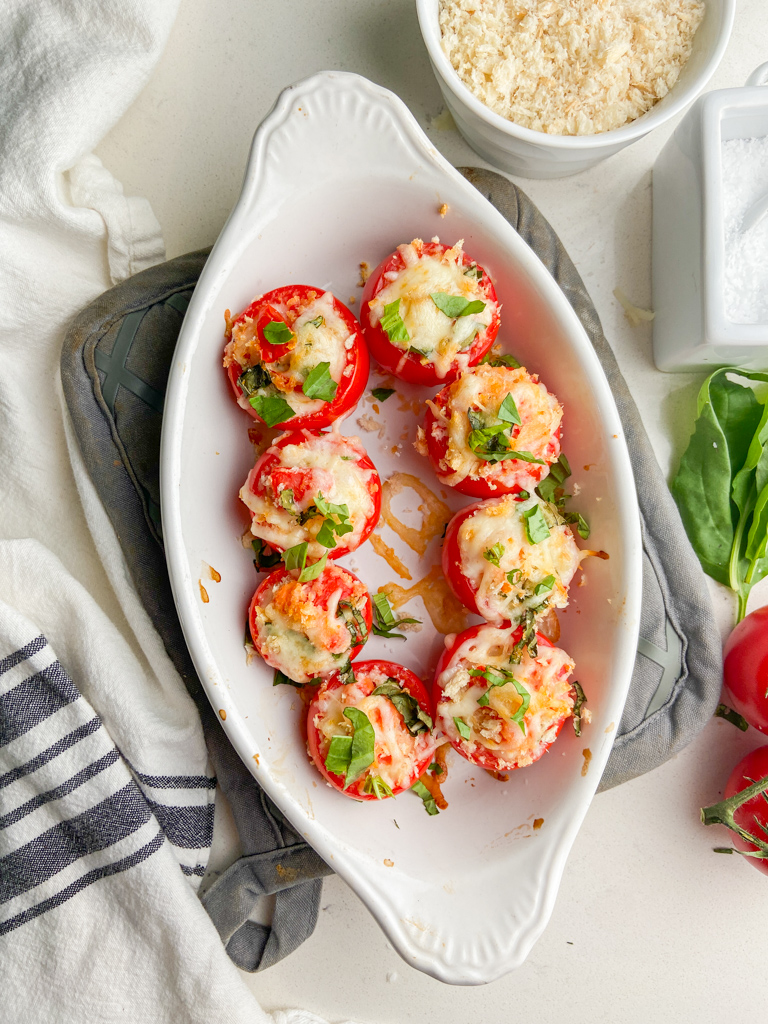 Overhead photo of stuffed tomatoes in a baking dish. 