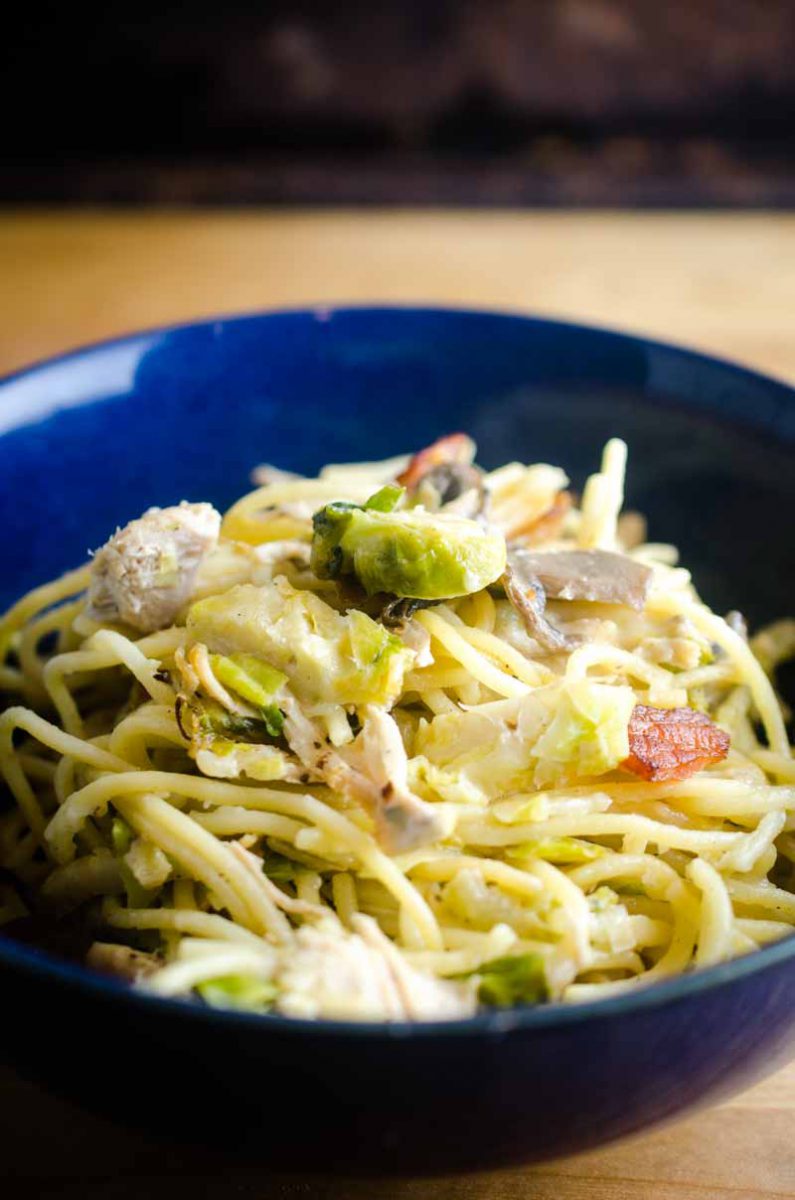 Use your leftover turkey to make this creamy Baked Turkey Spaghetti. Loaded with shredded turkey, brussels sprouts, mushrooms, bacon and cheese. 