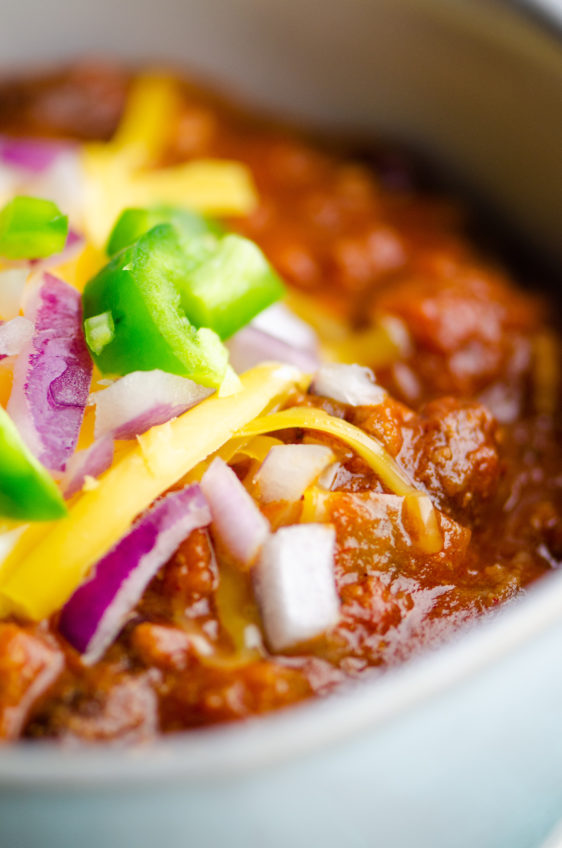 Close up photo of beef chili in a bowl.