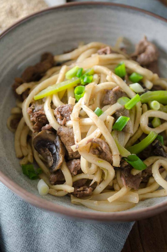 Beef noodle stir-fry is one of my favorite comfort foods. It is loaded with thinly sliced beef, peppers, mushrooms, onions and udon noodles.