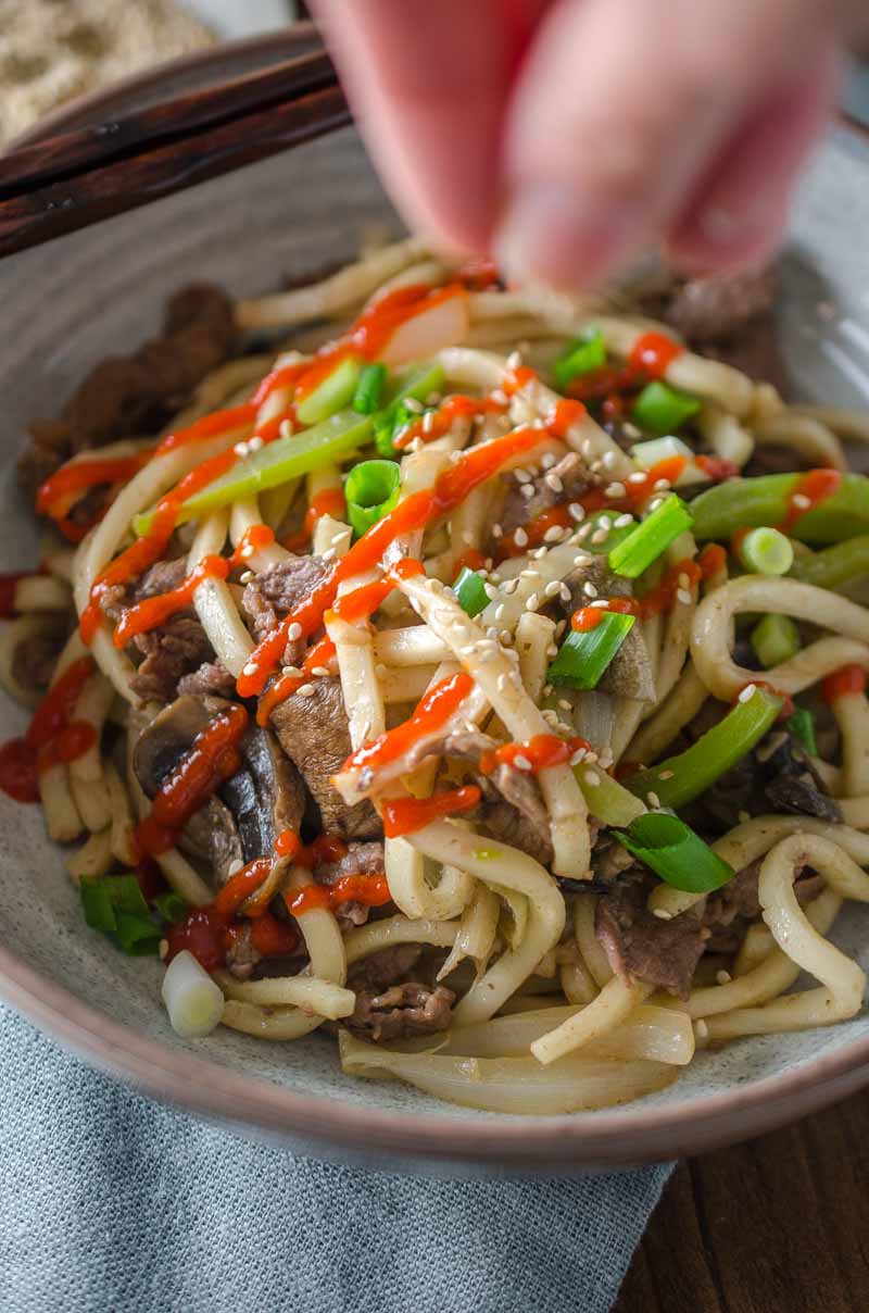 Beef noodle stir-fry is one of my favorite comfort foods. It is loaded with thinly sliced beef, peppers, mushrooms, onions and udon noodles. 