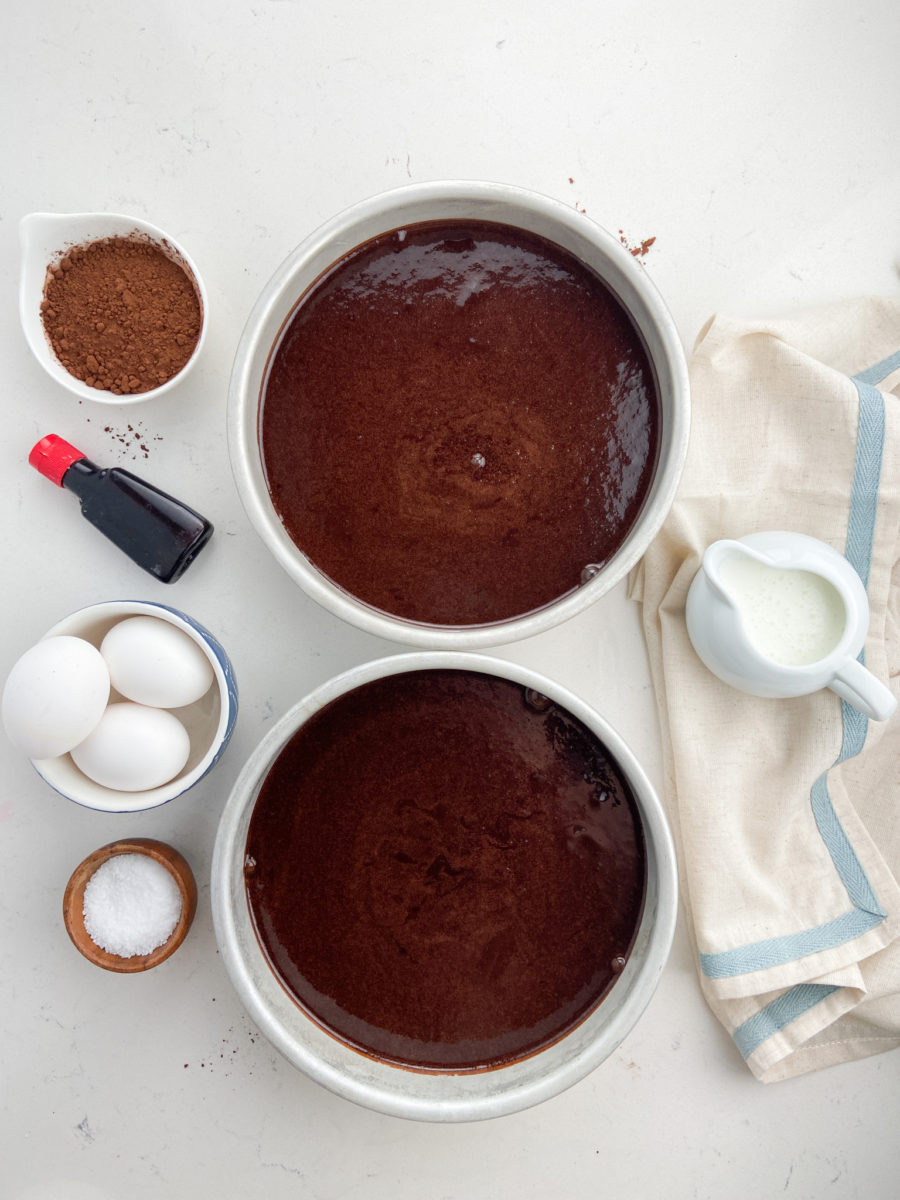 Two 8 inch chocolate cakes in cake pans.