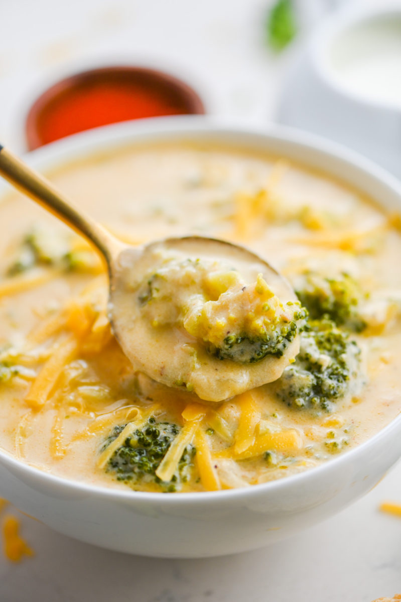 Spoonful of broccoli cheddar soup. 