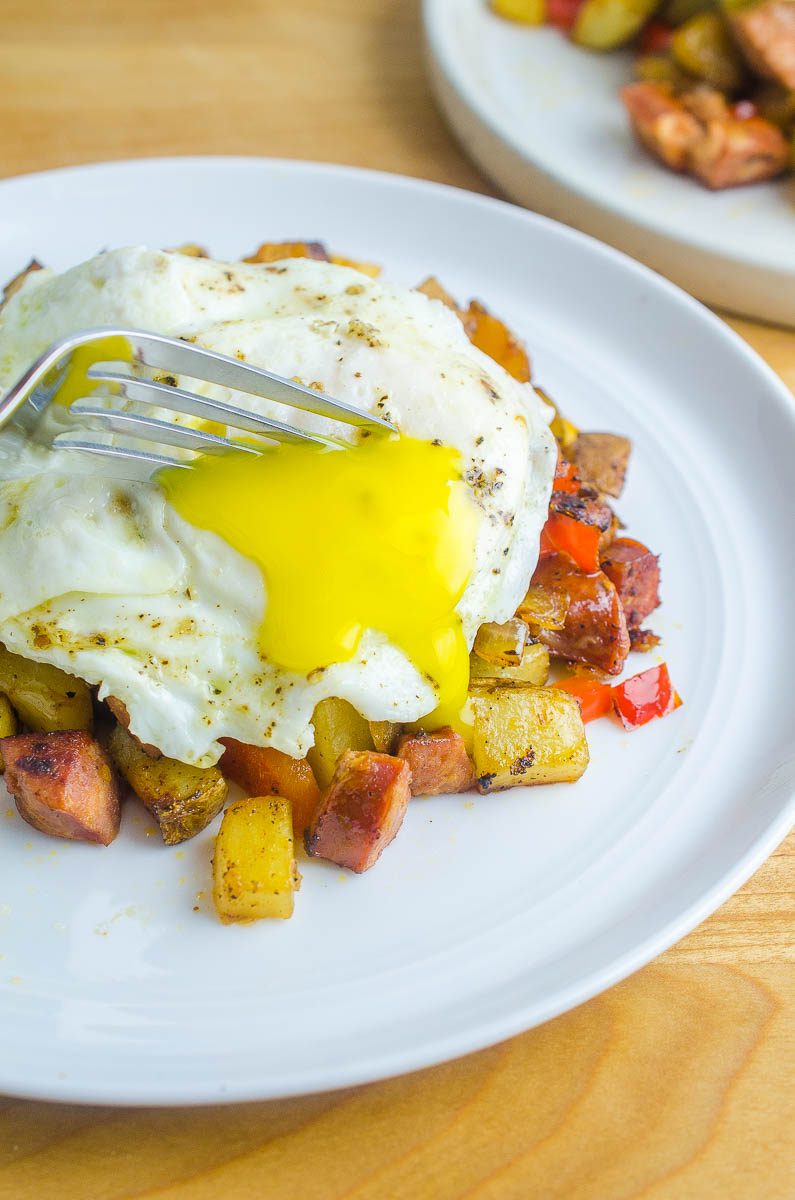 Cutting into over easy egg. 