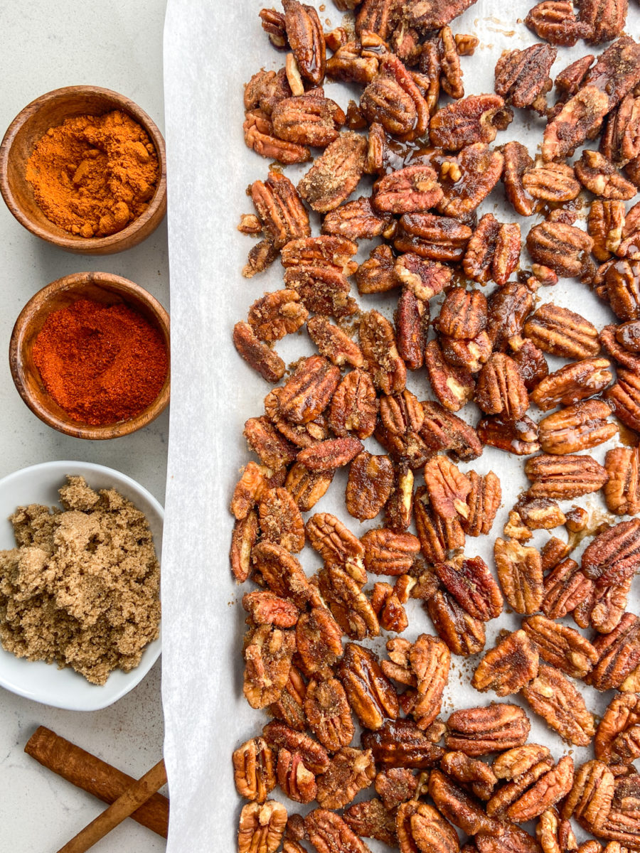 Candied pecans on baking sheet. 