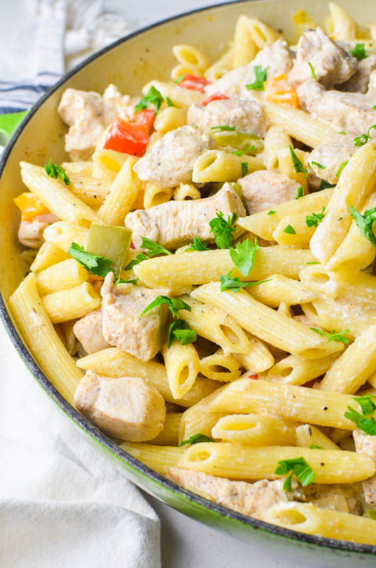 Caribbean Jerk Chicken Rasta Pasta in a green skillet.