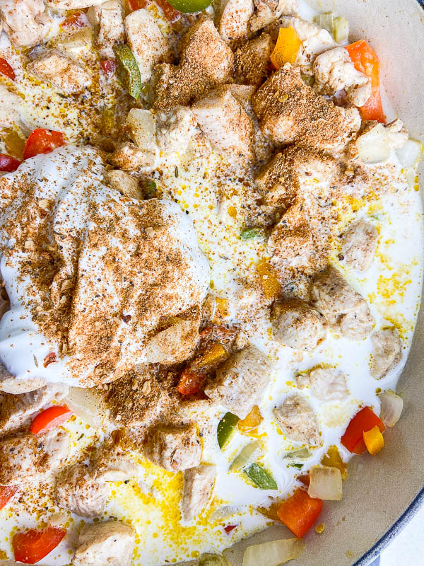 Photo of rasta pasta with sour cream, half and half, chicken and bell peppers. 
