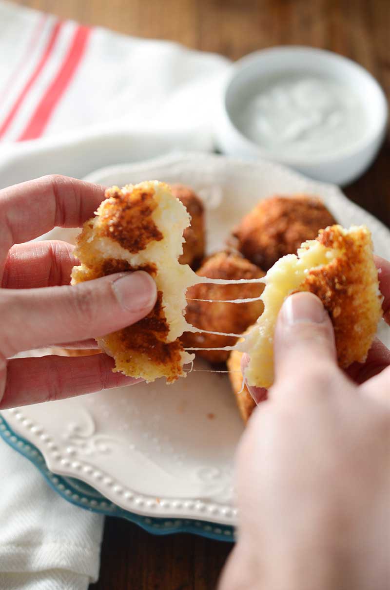 Cheesy Roasted Garlic Potato balls are basically the best way to use up holiday leftovers. Ever.