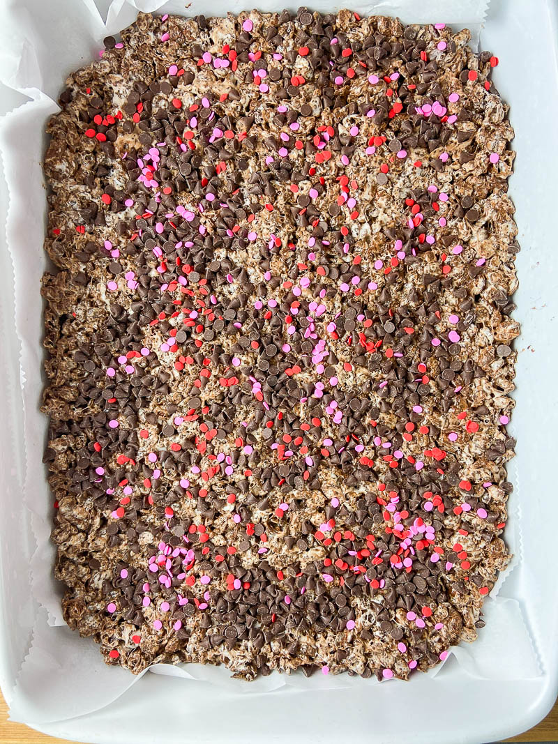 Overhead photo of cocoa pebble krispie treats in a pan. 