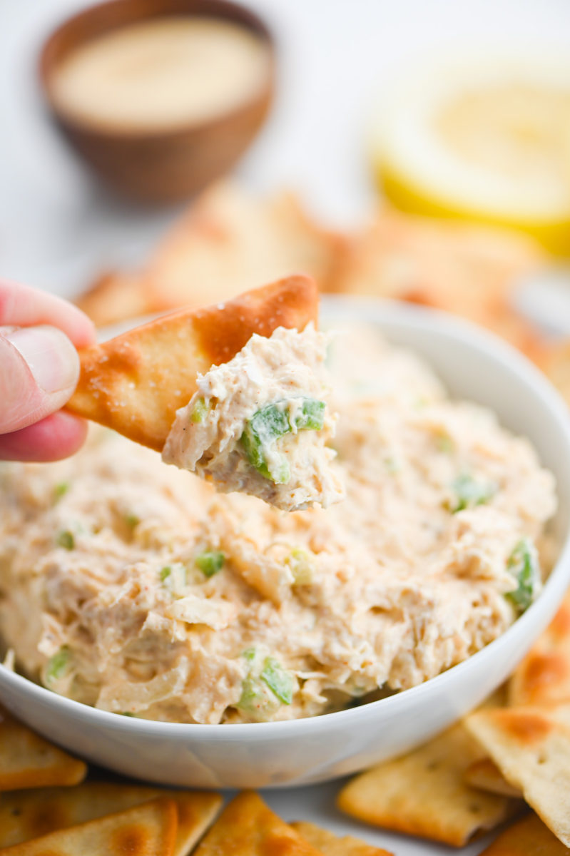 Pita chip scooping Cold Crab Dip.