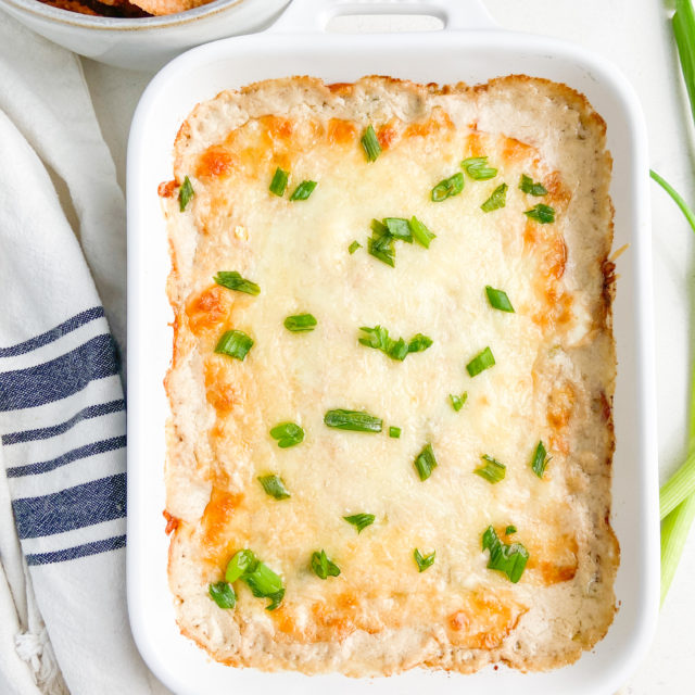 Overhead photo of crab rangoon dip in white baking dish.