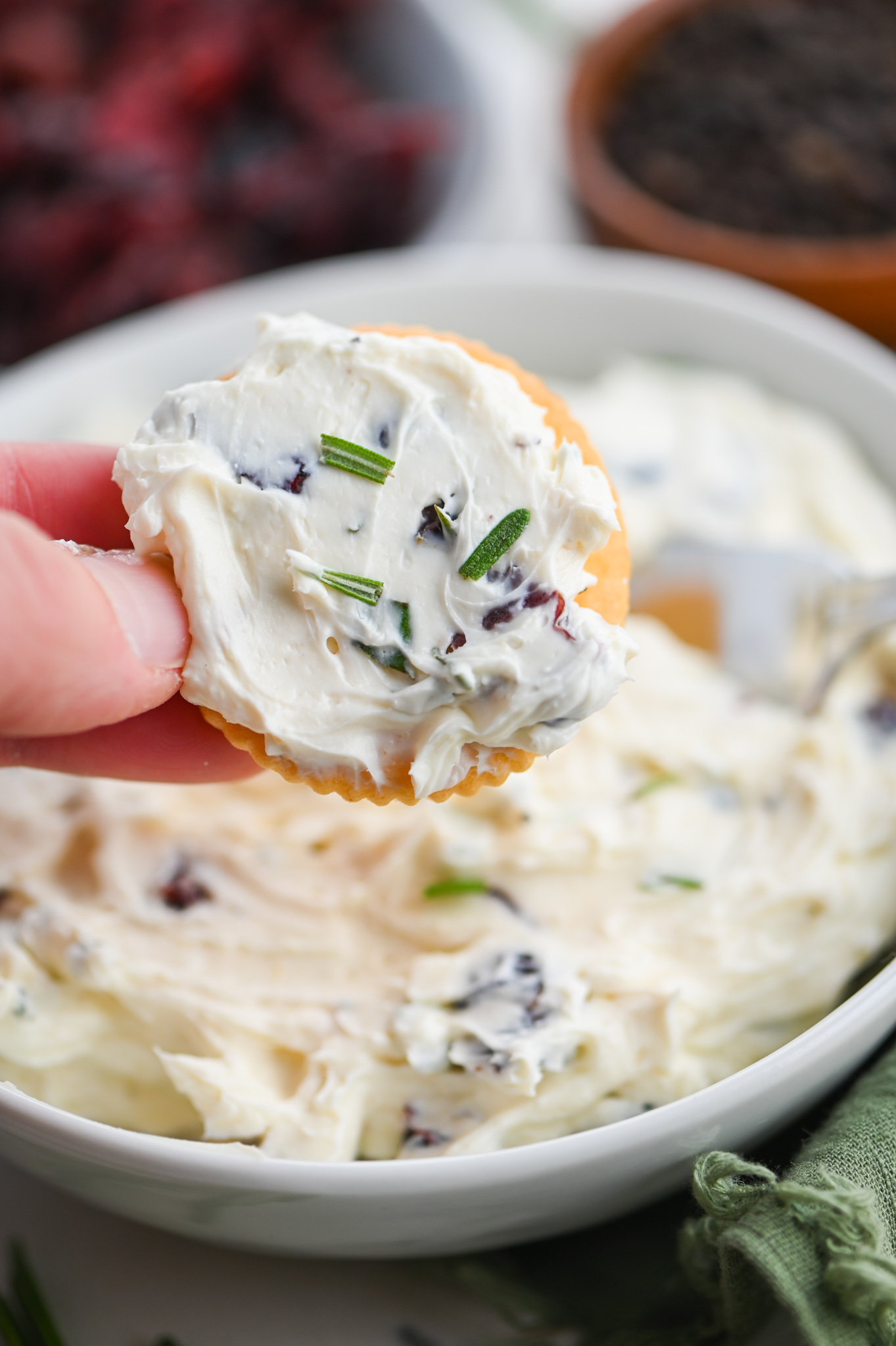 Cranberry cream cheese on a cracker. 