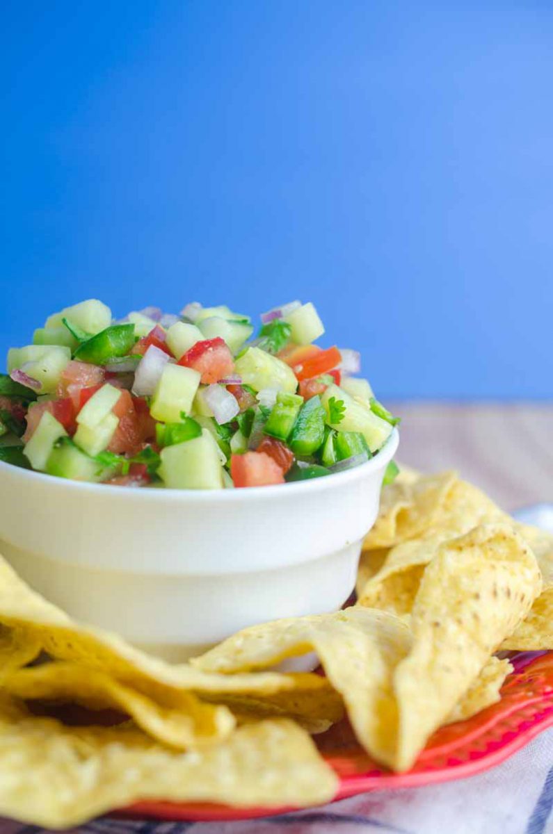 Cucumber Salsa is quick easy and will be your new favorite way to use cucumbers. Only 6 ingredients: cucumbers, lime, tomatoes, cilantro, onion & jalapeño.