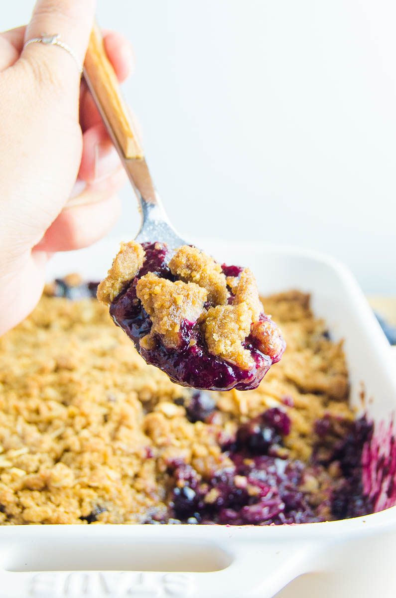 A spoonful of blueberry crisp. 