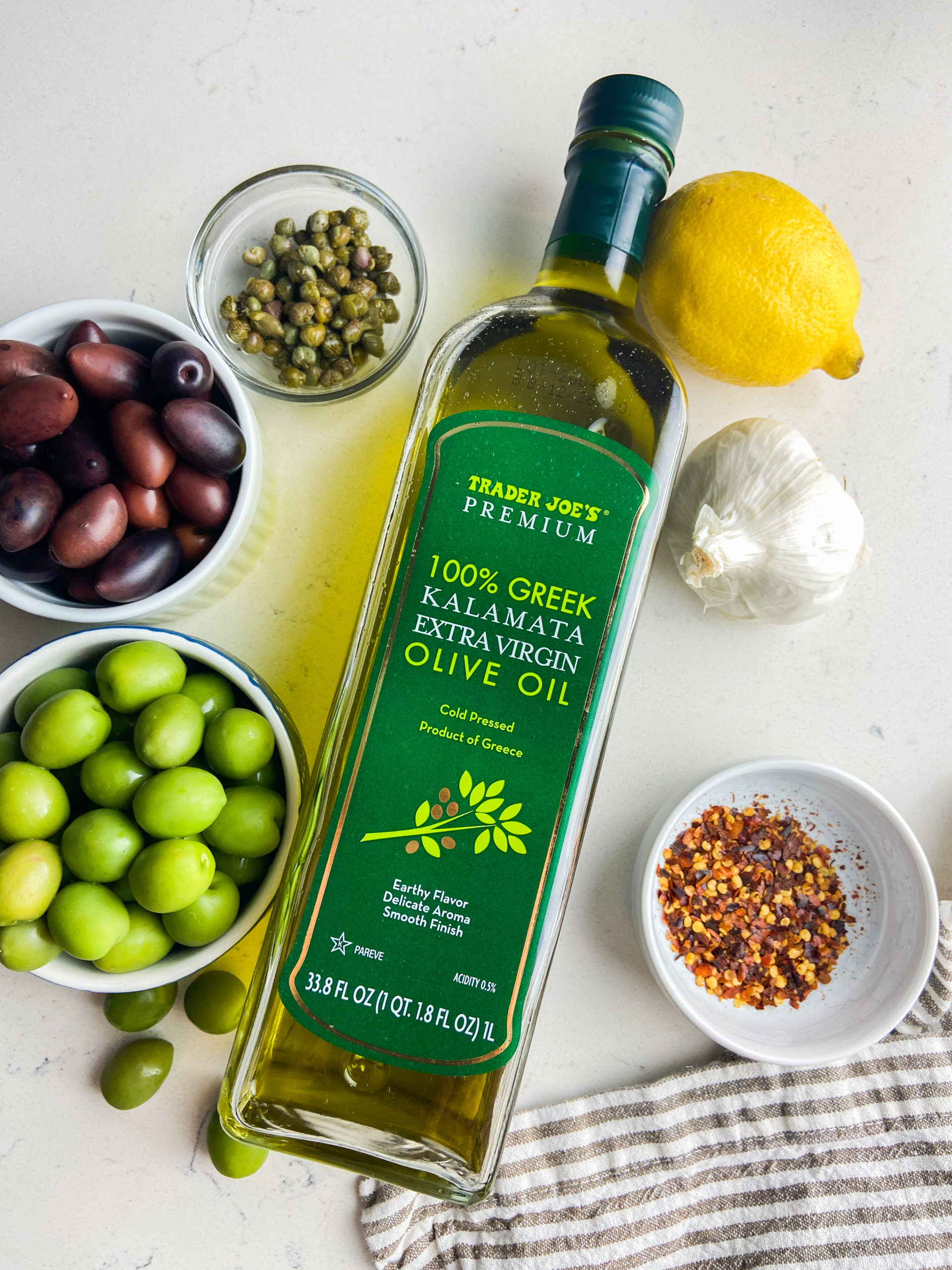 overhead photo of ingredients needed to make marinated olives. 