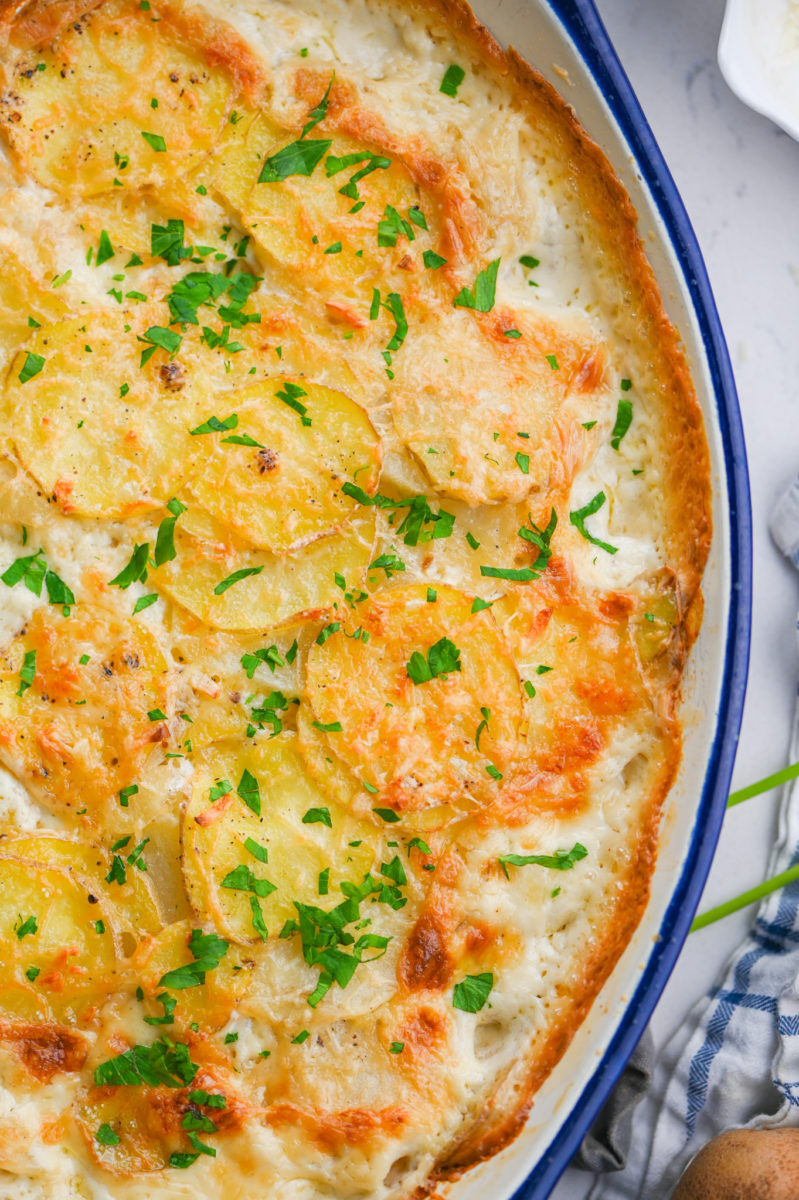 Easy scalloped potatoes in oval casserole dish.