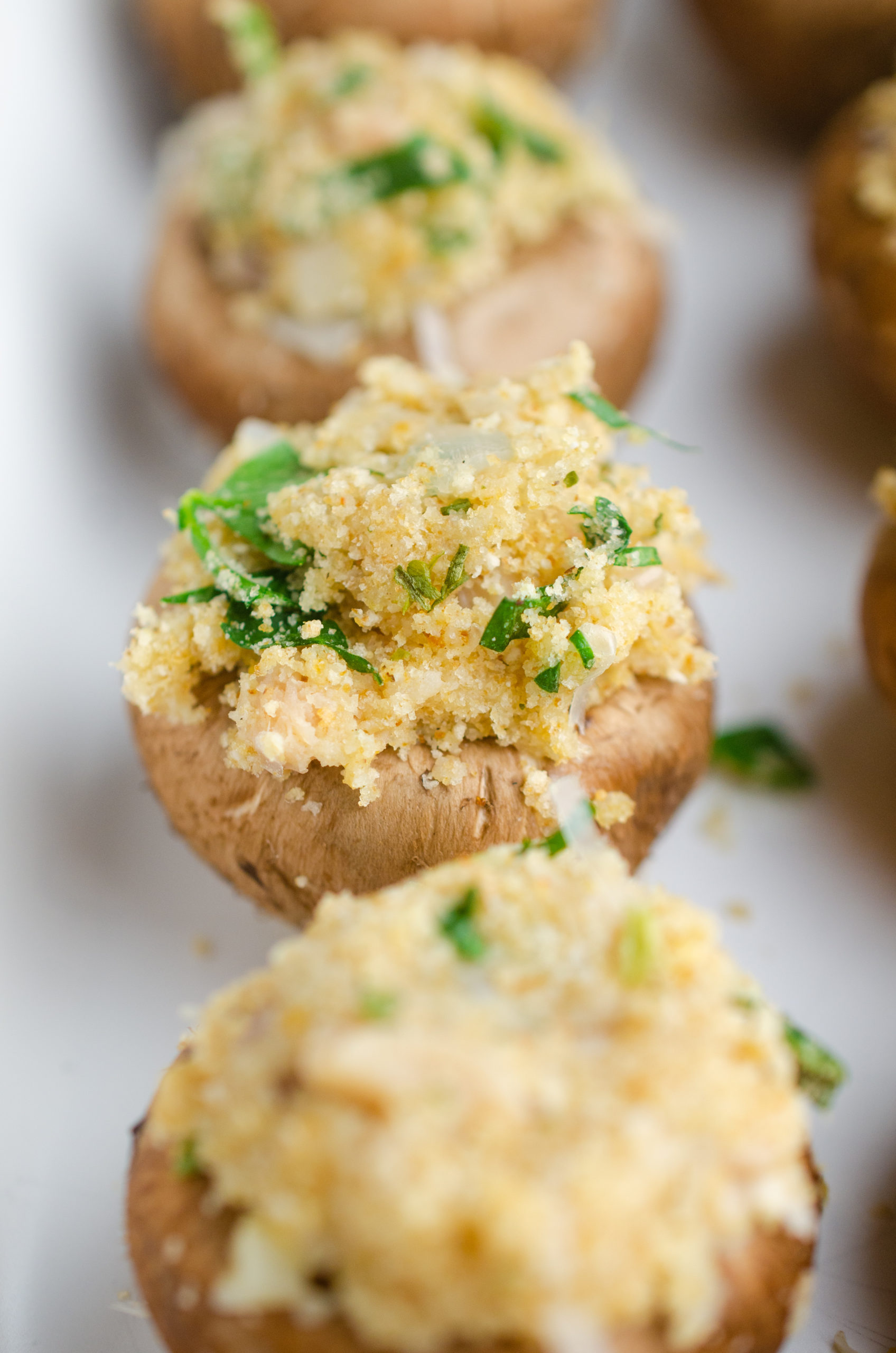 Close up photo of uncooked stuffed mushroom. 