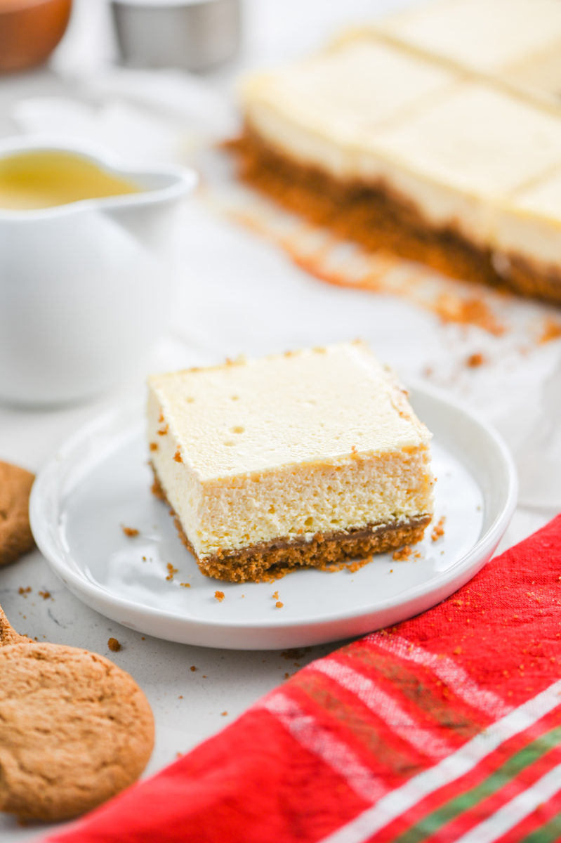 Eggnog Cheesecake Bar on white plate. 