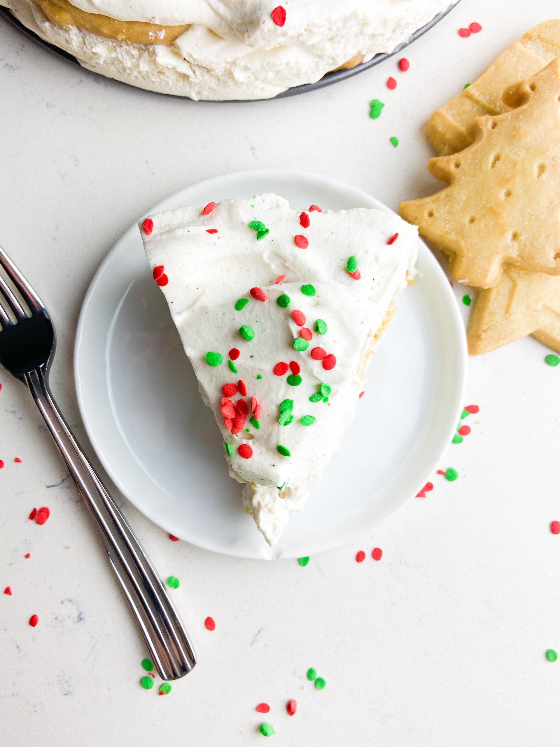 Slice of eggnog icebox cake with Christmas sprinkles. 