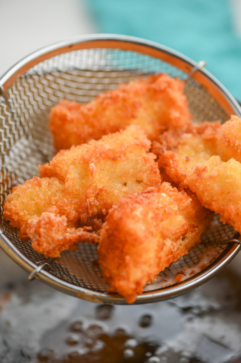 Fried fish in strainer. 