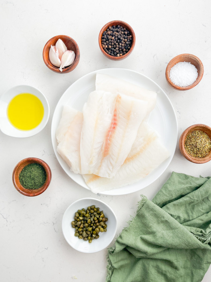 Overhead photo of ingredients needed to make fish en papillote. 