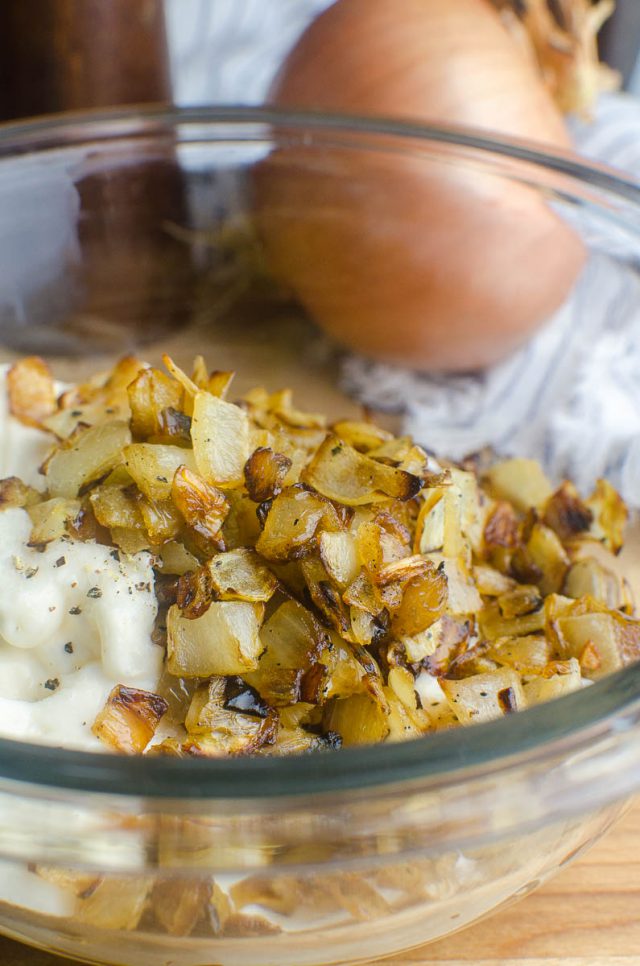 French onion dip ingredients in a bowl. 