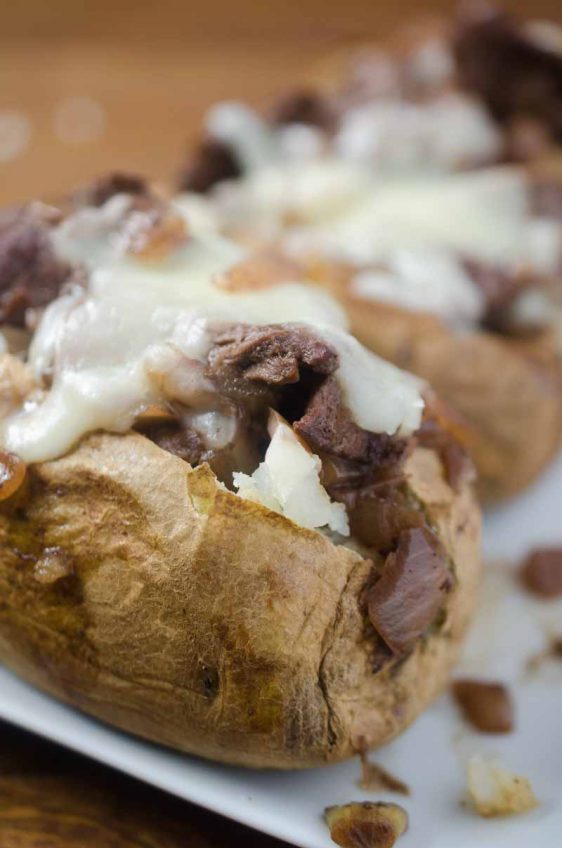 Make baked potatoes a meal with these French-Style Beef Baked Potatoes. They are loaded with thinly slice top sirloin, caramelized onion sauce and shredded Swiss cheese.