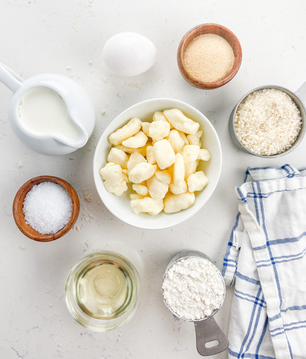 Overhead photo of fried cheese curds ingredients on white background. 