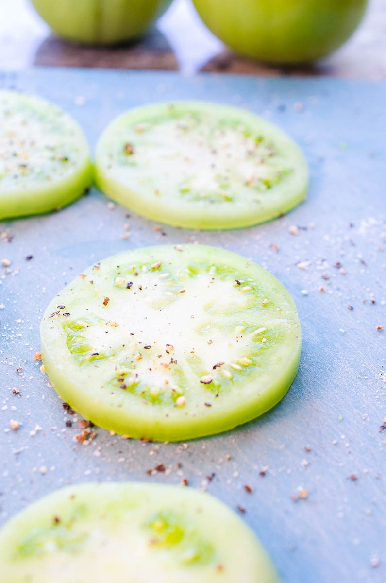 Season tomatoes with salt and pepper. 