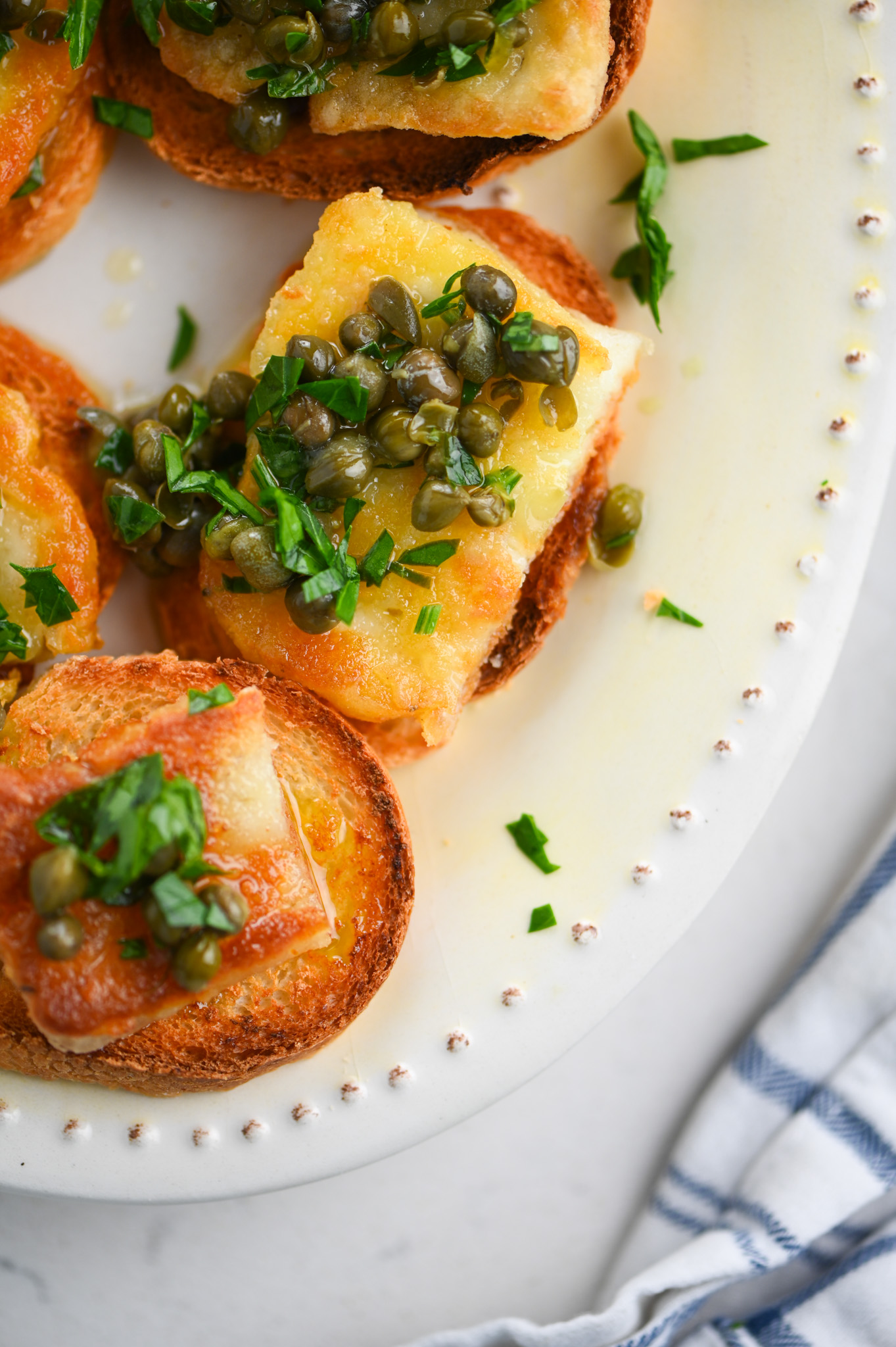 Fried Halloumi Crostini with Lemon Caper Oil