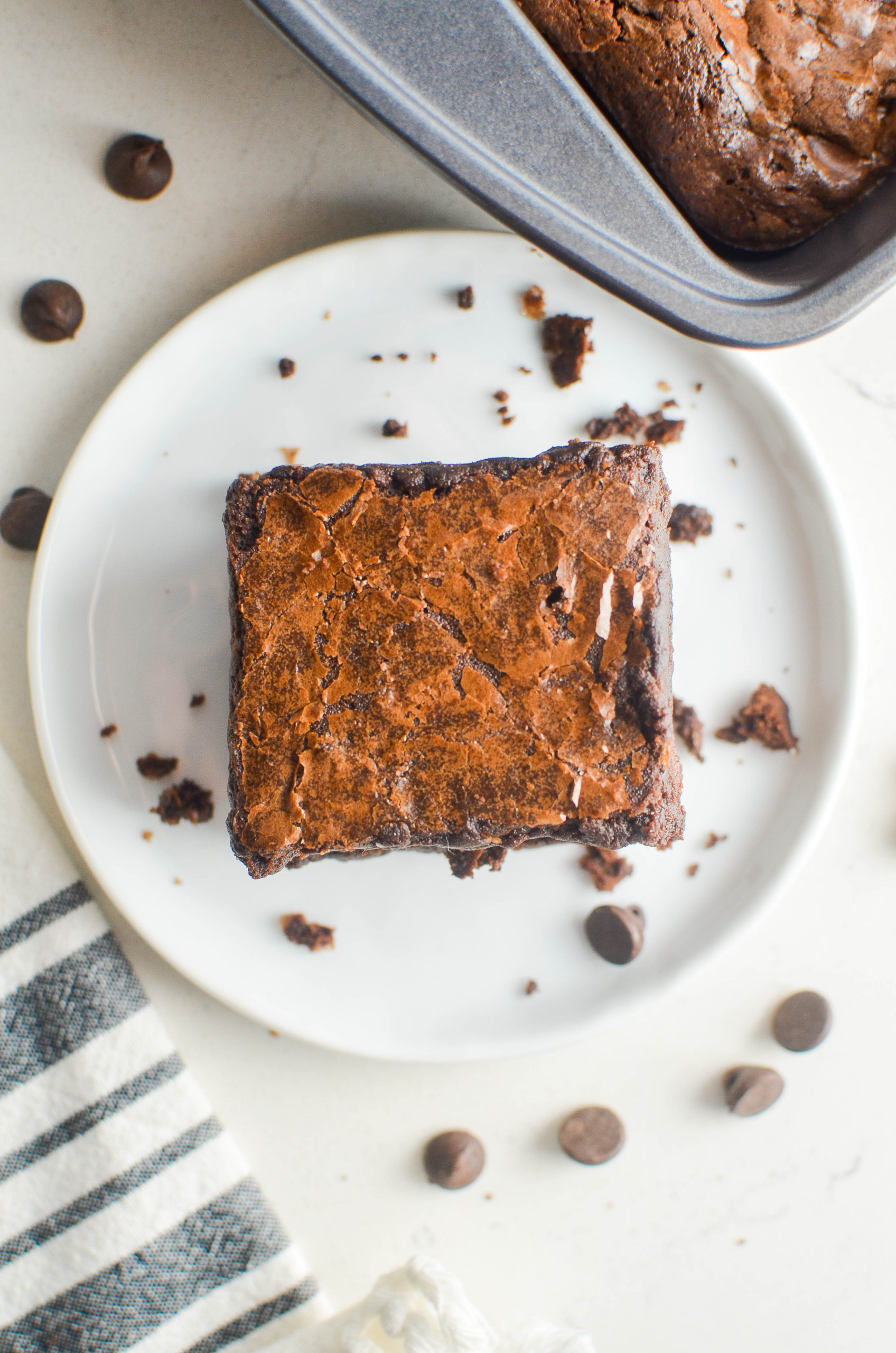 Overhead photo of brownie on a plate. 