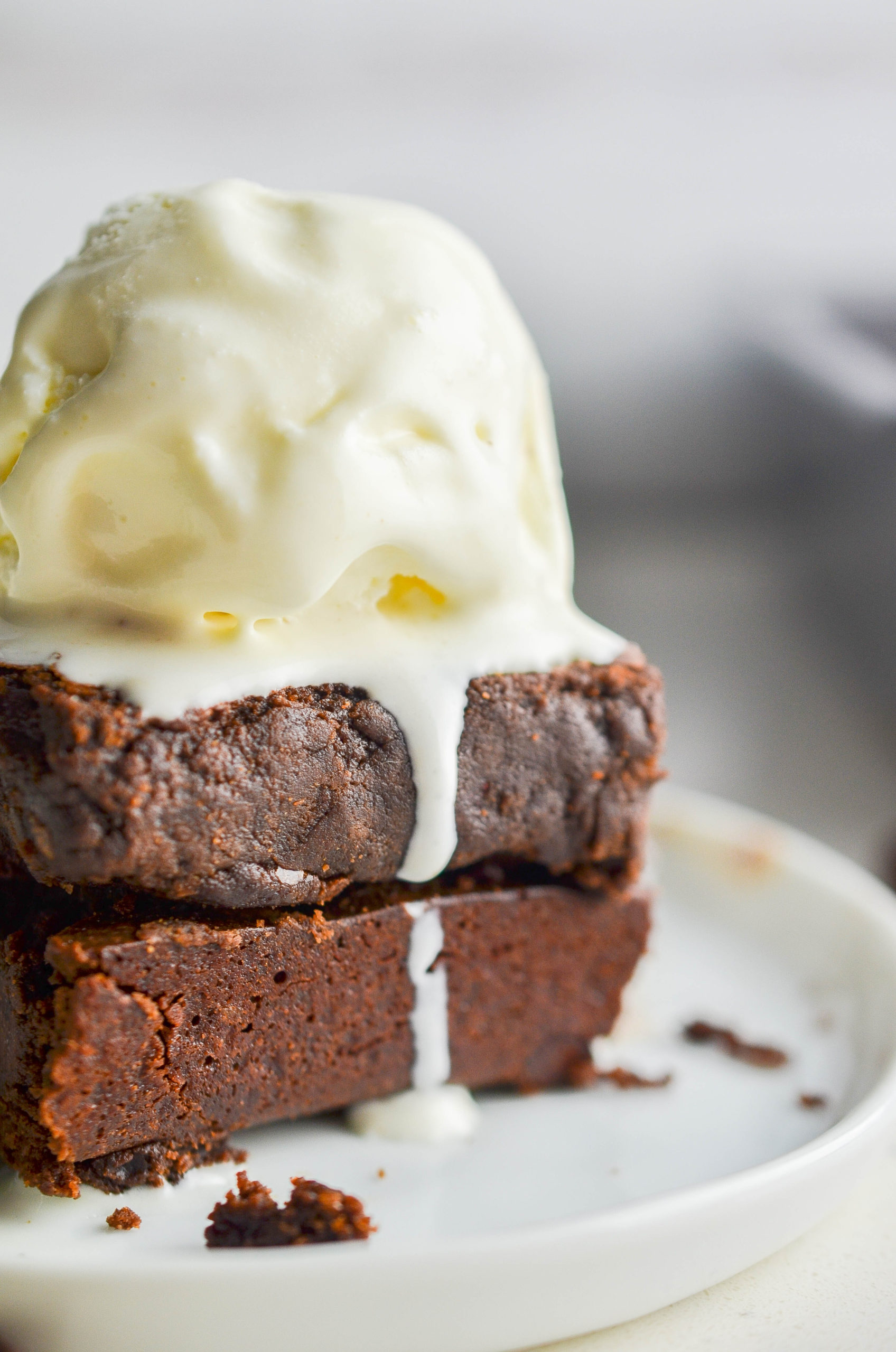 Brownies with ice cream on top. 