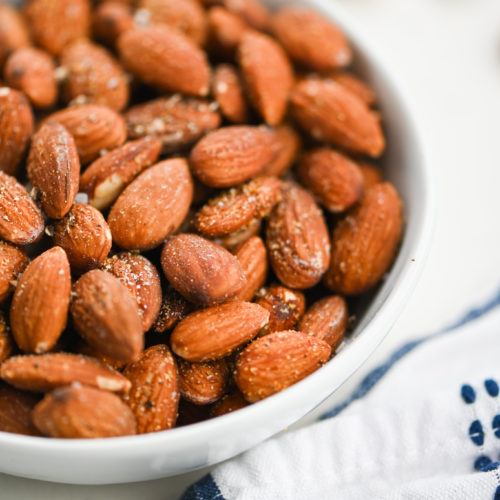 Garlic almonds in a white bowl.